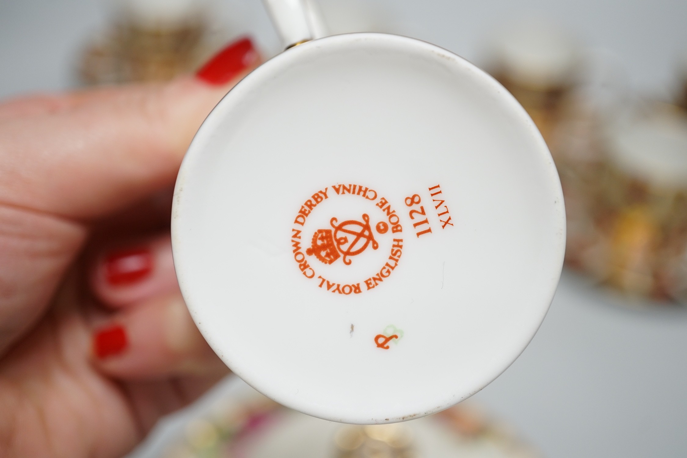 Six Royal Crown Derby coffee cans and saucers and a Royal Albert Country Roses dish and cover